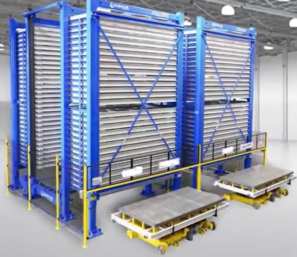 Cantilever sheet metal storage tower with loading trolleys